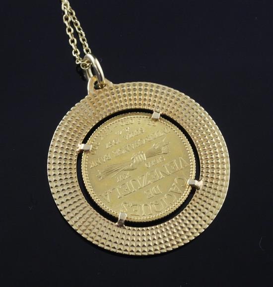 An 18ct gold pendant inset with Caciques de Venezuela commemorative gold coin (Chief Urimore), on fine-link chain, 19.5in.